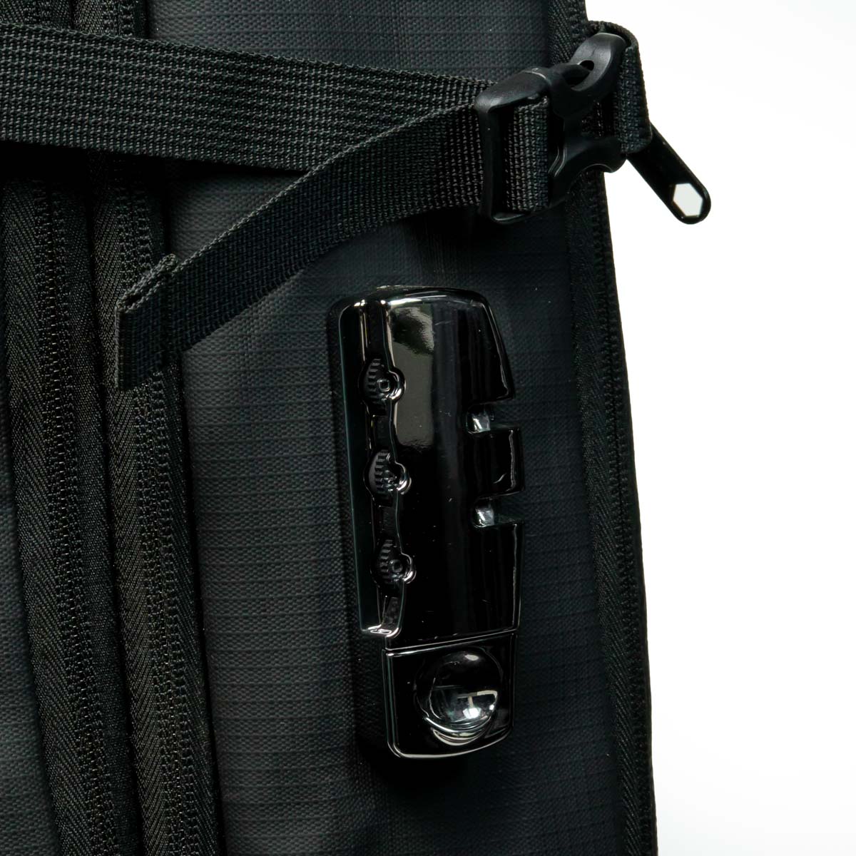 Close-up of a black bag with a metallic clasp on a white background