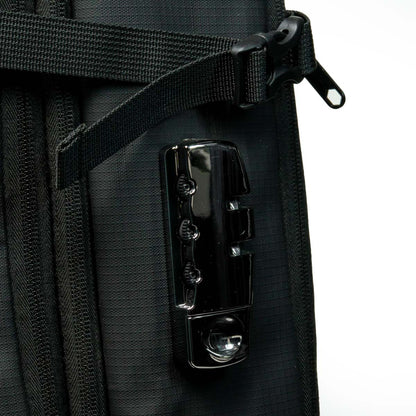 Close-up of a black bag with a metallic clasp on a white background